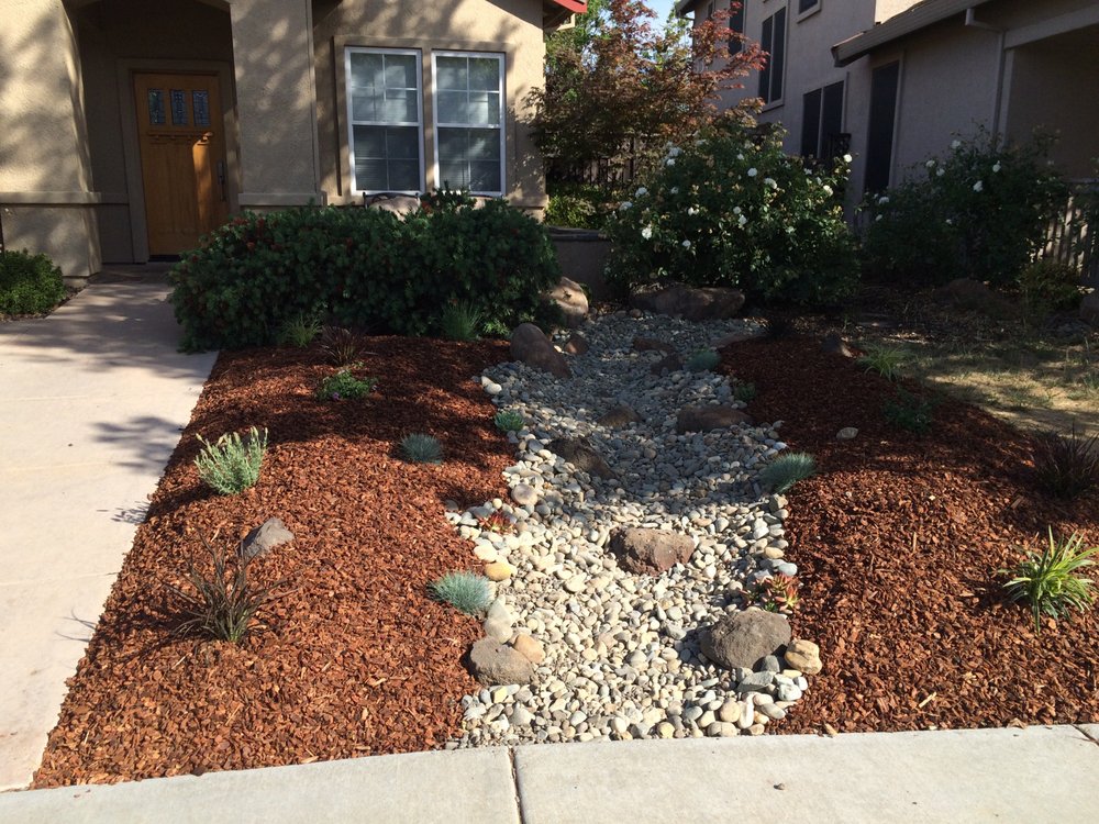 Stone patio with pergola